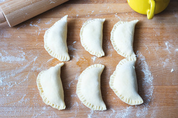 tasty pierogi on wooden table, polish traditional food