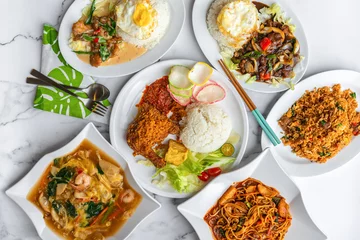 Tuinposter Variety of Asia Muslim Malay daily home cooked food on table. Flat lay top down table view. © Jerome Quek