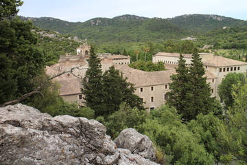 Fototapeta na wymiar Look to roofs of Monastery Santuari de Lluc in Serra de Tramuntana, Mallorca, Spain
