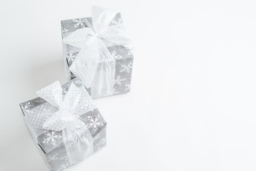 Christmas gift box with festive decoration on white background