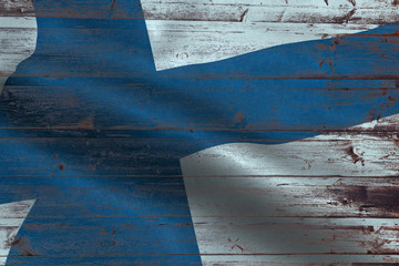 Finland flag on an old wooden plank forming a background