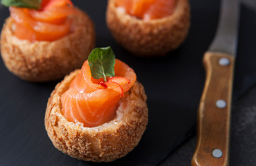 Gourmet salmon appetizer. Sandwich with salmon.