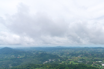 Obraz premium beautiful blue sky high peak mountains mist fog wildlife green forest at Khao Koh, Phu Tub Berk, Phetchabun, Thailand guiding idea long weekend for backpacker camping campfire relaxing hiking