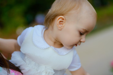 Smiling girl on the meadow looking right at camera. authentic image.