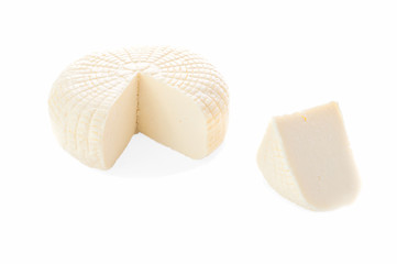 Sulguni cheese. A piece of triangular shape is cut out. Isolated on a white background.