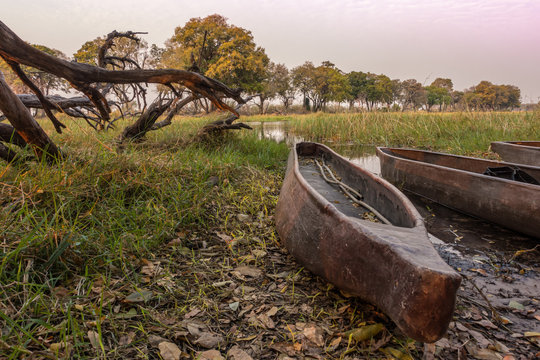 old wooden conoe boat on the river