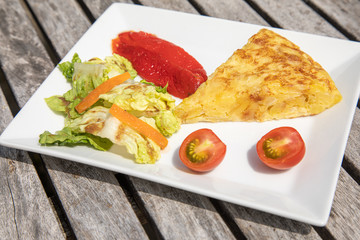 Spanish omelette tortilla with salad tomato tomatoes paprika vegetarian healthy eating food