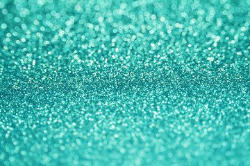Beautiful Glitter Background. Blue Turquoise Colors. Shine Bokeh Effect. For party, holidays, celebration, New Year and Christmas.