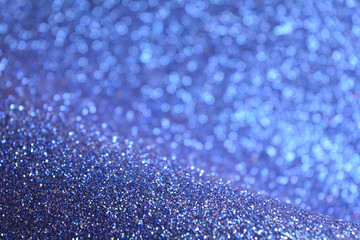 Winter Magic Blue Sparkle Glitter Lights Background. Sapphire Color. Shine Bokeh Effect. For party, holidays, celebration.