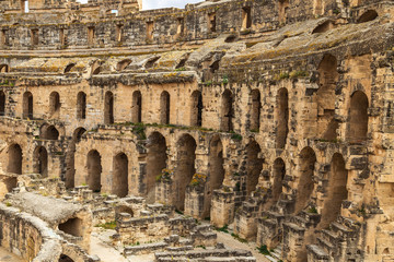 Fototapeta na wymiar Old antique amazing well conserved huge Amphitheatre of El Jem in Tunisia. Horizontal color photography.
