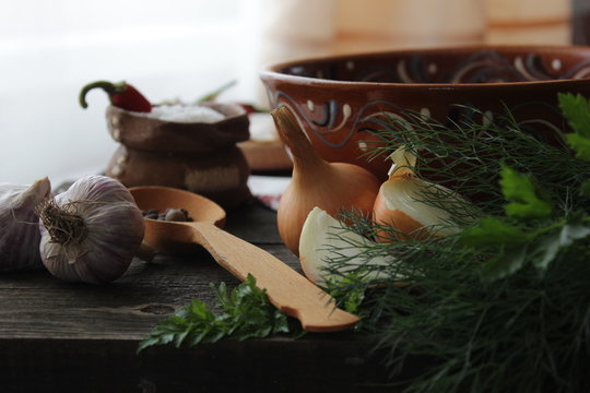 Beet soup in wooden plate with vegetables on wooden table. Borch, traditional Ukrainian food
