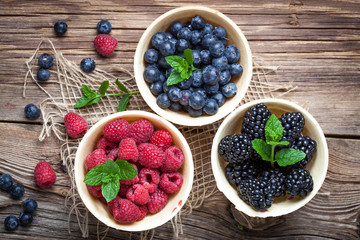 Blackberries, raspberries and blueberries in a waffle bowls.