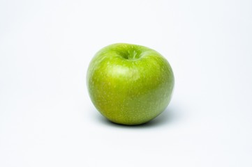 Green sweet apple on white background