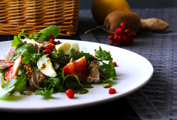 Salad with arugula, tomato, tuna, eggs, . Summer salad idea and recipe for healthy vegetarian lunch, dinner. Copy space.