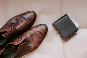 brown retro leather shoes and wallet.