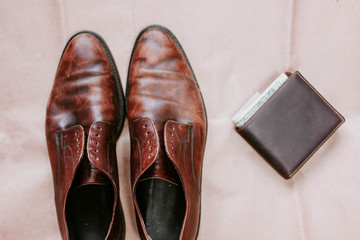 brown retro leather shoes and wallet.