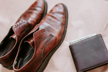 brown retro leather shoes and wallet.