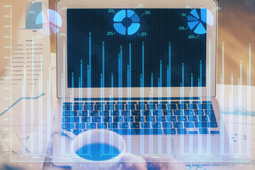 Double exposure of forex graph and work space with computer. Concept of international online trading.