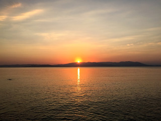 Beautiful sunset on Santorini island, Greece. Famous travel destination. Summer landscape, sea view