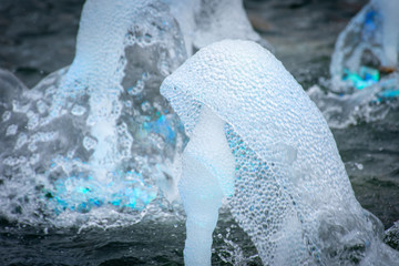 Water fountain close up spray of refreshing, cool, water droplet design in a fountain at a park.