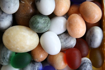 Fototapeta na wymiar Background of onyx stone eggs of different colors