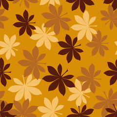 A seamless vector autumn pattern with bukeye leaves in mustard colors. Seasonal surface print design. Great or fabrics, backgrounds and stationery.