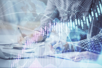 Multi exposure of forex chart with man working on computer on background. Concept of market analysis.