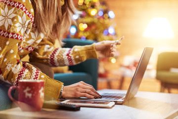 Woman doing online shopping at Christmas