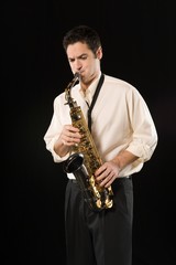 Obraz na płótnie Canvas Businessman Playing Music Using Saxophone