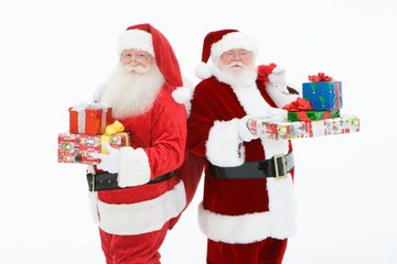 Senior Men Standing With Gifts In Santa Claus Outfit