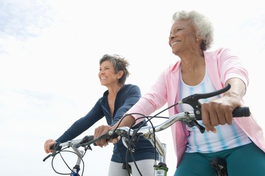 Senior Female Friends Riding Bicycle