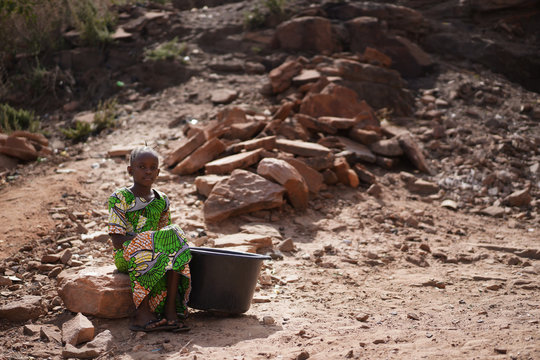 Water is life, Black Young African Girl walks hours to get to Well