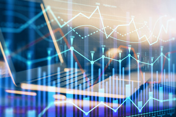Financial graph colorful drawing and table with computer on background. Double exposure. Concept of international markets.