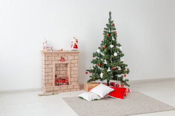 Fireplace and Christmas tree with presents in living room