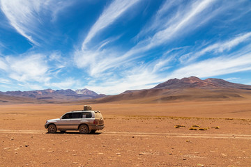 Fototapeta na wymiar Altiplano, Bolivia.10-29-2019. Four wheels drive car for the transportation of tourists on the altiplano in Bolivia.