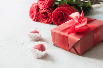Valentines day greeting card with romantic gift, red roses, sweets on white. Space for text.