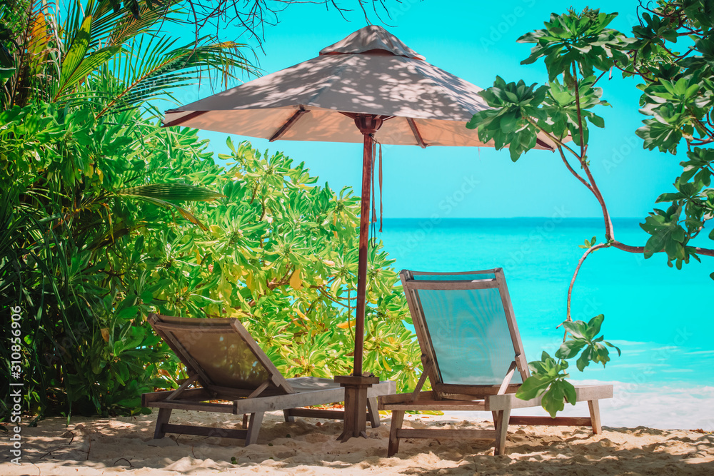 Wall mural two beach chairs on tropical sea vacation