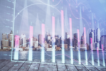 Forex graph on city view with skyscrapers background double exposure. Financial analysis concept.