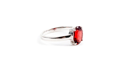 Ring with the red ruby stone isolated on white