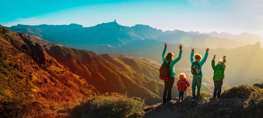 happy family travel in mountains at sunset, panorama