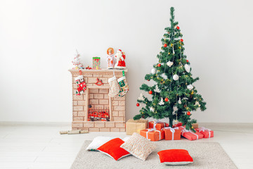 Fireplace and Christmas tree with presents in living room