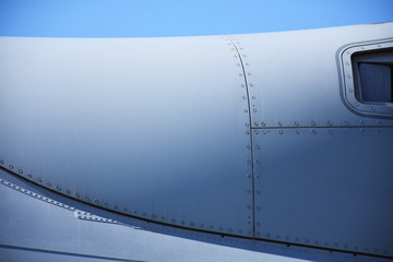 Side view airplane fuselage with sky