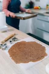 Background with Gingerbread Men dough for Christmas cookies