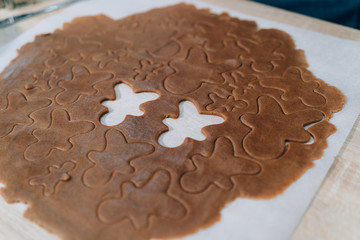 Background with Gingerbread Men dough for Christmas cookies