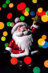 Merry christmas from Santa Claus with colour lights and black background. Holidays greeting card. Xmas theme. Frame and banner.