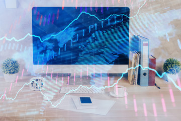 Forex graph hologram on table with computer background. Double exposure. Concept of financial markets.