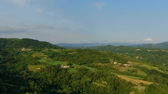 Orchard farm and lake Butoniga water reservoir dam in Croatia pan right motion, Aerial drone reveal shot