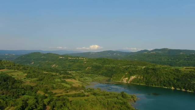 Lake Butoniga water dam in Croatia left pan revealing nearby hills, Aerial drone left pan reveal shot
