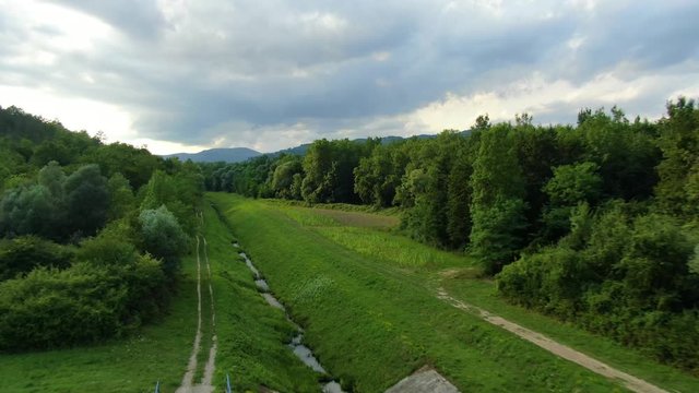 Lake Butoniga Croatia water canal tributary system with low flow, Aerial drone low flyover shot