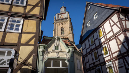 Fototapeta na wymiar half-timbered houses with church tower and art nouveau building
